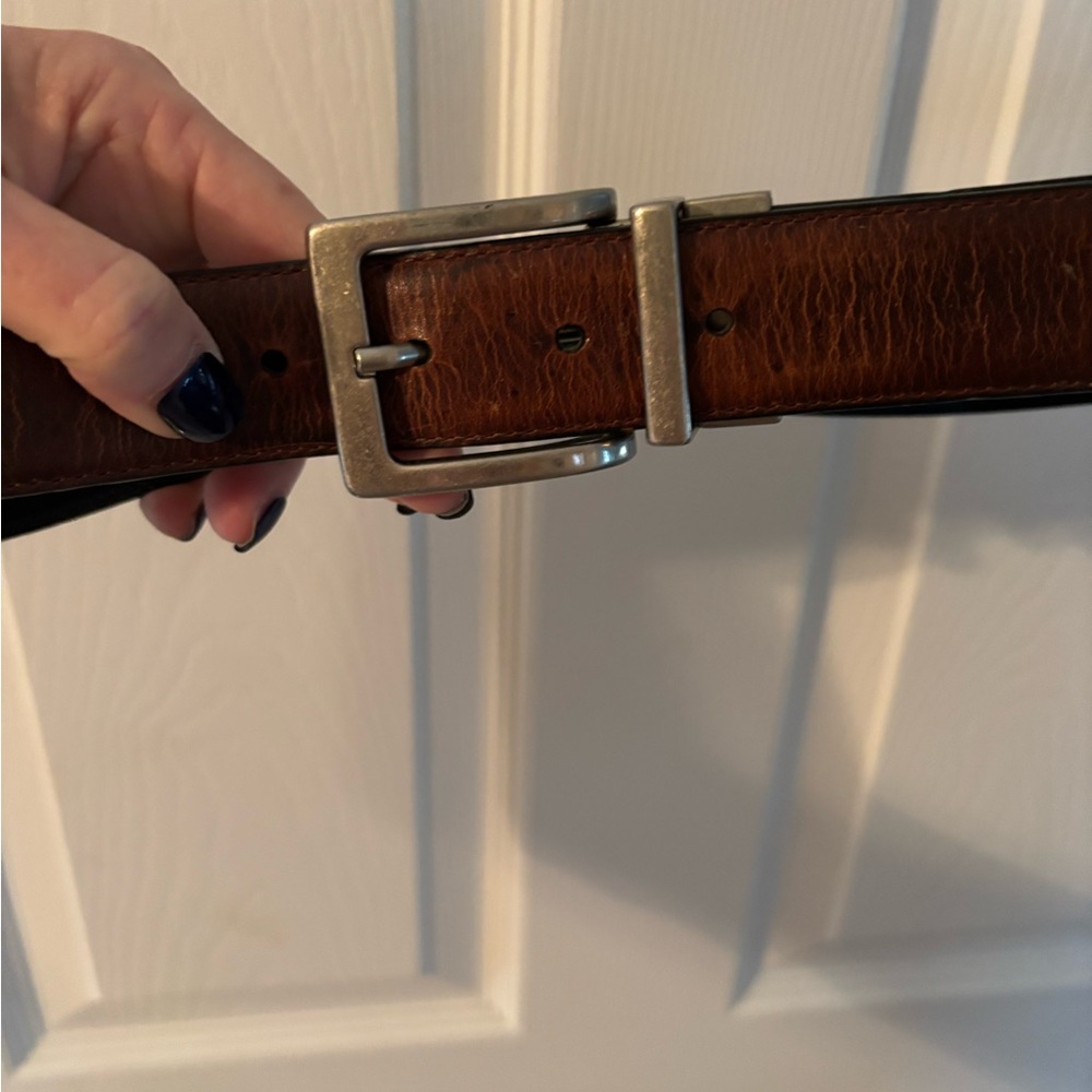 Brown belt with braid design. Size 34.